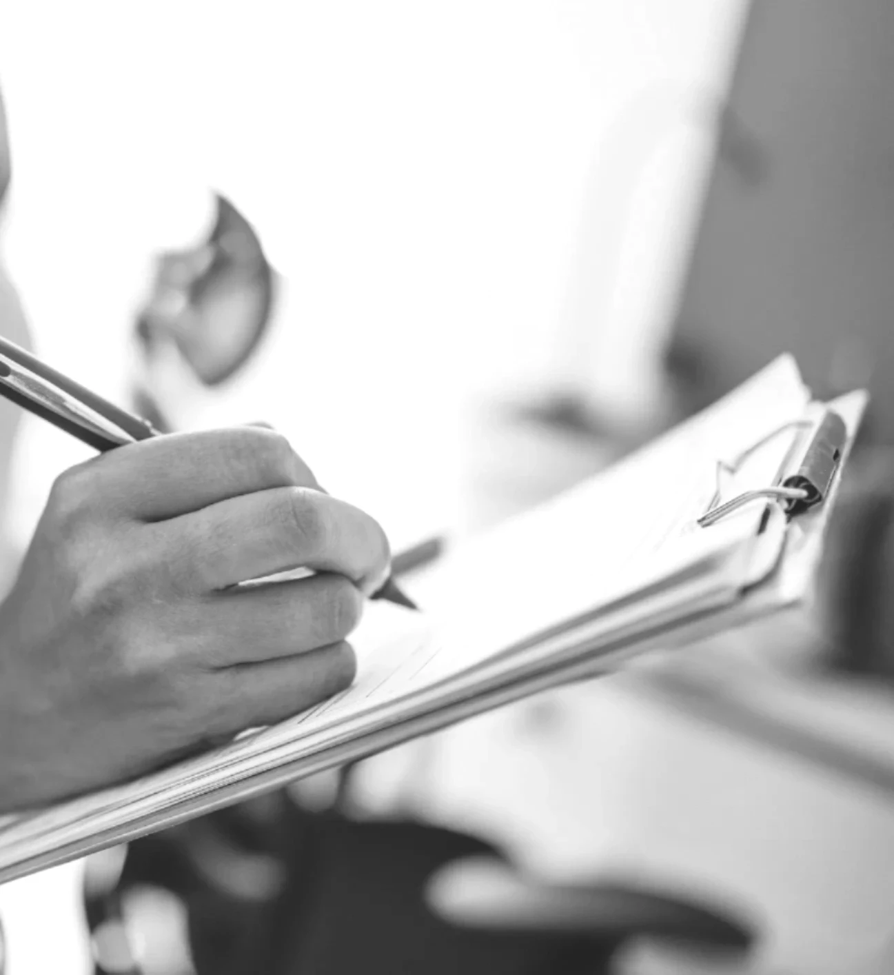 Technician completing NFPA 96 compliance checklist